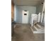 A covered porch with a grill, stairs, refrigerator, and a door at 622 Dreama Dr, Davenport, FL 33897