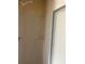 Bathroom shower with white walls and sliding door at 622 Dreama Dr, Davenport, FL 33897
