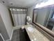 Bathroom featuring granite counters, tub-shower combination and dark wood vanity at 6337 Parc Corniche Dr # 2311, Orlando, FL 32821