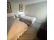 This bedroom offers two beds with comfortable bedding and ample space at 6337 Parc Corniche Dr # 2311, Orlando, FL 32821