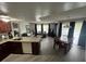 Bright open floor plan offering a spacious living room with dining area and updated kitchen at 6337 Parc Corniche Dr # 2311, Orlando, FL 32821