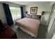 This is a light filled main bedroom with a view of the community at 6337 Parc Corniche Dr # 2311, Orlando, FL 32821