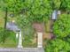 Aerial view of the home's roof, driveway and surrounding mature trees at 6421 Nw 61St St, Ocala, FL 34482