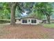 Backyard shot with a view of the sunroom on the back of the house at 6421 Nw 61St St, Ocala, FL 34482