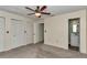 Bedroom featuring neutral carpeting, closets, and an ensuite bathroom at 6421 Nw 61St St, Ocala, FL 34482