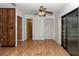 Light filled bedroom has hard wood floors, fan, and lots of natural light at 6421 Nw 61St St, Ocala, FL 34482