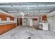 Spacious garage featuring laundry, utility sink, and storage cabinets at 6421 Nw 61St St, Ocala, FL 34482