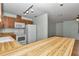 Bright kitchen showcases wood cabinets, white appliances, and an eat-in peninsula at 6421 Nw 61St St, Ocala, FL 34482