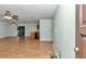 Open-concept living area with wood floors seamlessly connecting to the kitchen bar at 6421 Nw 61St St, Ocala, FL 34482