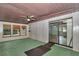 Sunroom features multiple windows, a ceiling fan, and sliding glass doors at 6421 Nw 61St St, Ocala, FL 34482