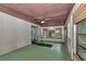 Sunroom features multiple windows, a ceiling fan, and a sliding glass door to the backyard at 6421 Nw 61St St, Ocala, FL 34482