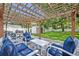 Backyard patio features comfortable seating, string lights, and green landscaping at 727 Seminole Ave, Orlando, FL 32804