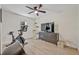 Bedroom with workout equipment, dark dresser, and hardwood flooring at 727 Seminole Ave, Orlando, FL 32804