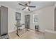 This room boasts a ceiling fan, a large window, and hardwood flooring at 727 Seminole Ave, Orlando, FL 32804