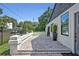 Attractive front porch with brick pavers, clean stucco wall and black framed windows, providing a welcoming entrance at 727 Seminole Ave, Orlando, FL 32804