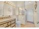 Bright bathroom with a shower and decorated vanity, with neutral colors throughout at 736 Timacuan Blvd, Lake Mary, FL 32746