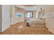 Bright bedroom features hardwood floors, decorative ceilings, and window views at 736 Timacuan Blvd, Lake Mary, FL 32746