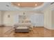 Bedroom features hardwood floors, decorative ceilings, and a spacious layout at 736 Timacuan Blvd, Lake Mary, FL 32746