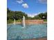 Community entrance featuring a water fountain and the 'Timacuan' sign. A Golf Community is printed below at 736 Timacuan Blvd, Lake Mary, FL 32746