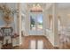 Inviting foyer features beautiful floors, glass double entry doors, and elegant details at 736 Timacuan Blvd, Lake Mary, FL 32746
