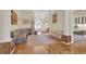 Spacious foyer with hardwood floors and an elegant design leading to other rooms at 736 Timacuan Blvd, Lake Mary, FL 32746