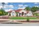 Charming home features a red tile roof, manicured lawn, and beautifully landscaped front yard at 736 Timacuan Blvd, Lake Mary, FL 32746
