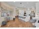 Open-concept kitchen flows into the living area, with a breakfast bar and stainless steel appliances at 736 Timacuan Blvd, Lake Mary, FL 32746