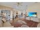 Open living room with a view to the kitchen and island with barstool seating at 736 Timacuan Blvd, Lake Mary, FL 32746
