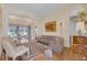Bright living room with a large window, patterned rug, and comfortable seating area at 736 Timacuan Blvd, Lake Mary, FL 32746