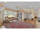 Open living room with large windows, comfortable seating and a beautiful view at 736 Timacuan Blvd, Lake Mary, FL 32746
