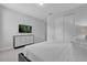 Serene bedroom with neutral tones, closet space, and a mounted flat screen television at 7524 Marker Ave, Kissimmee, FL 34747