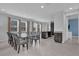 Spacious dining area with seating for eight, open layout, and seamless flow to the kitchen at 7524 Marker Ave, Kissimmee, FL 34747