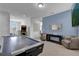 Spacious game room with an air hockey table and a view of the staircase and bonus room at 7524 Marker Ave, Kissimmee, FL 34747