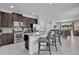 Modern kitchen featuring stainless steel appliances, granite countertops, and breakfast bar seating at 7524 Marker Ave, Kissimmee, FL 34747