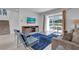 Inviting living room with plush seating, a flat-screen TV, and access to the outdoor patio at 7524 Marker Ave, Kissimmee, FL 34747