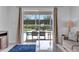 Bright living room with patio access, showcasing outdoor dining and pool views at 7524 Marker Ave, Kissimmee, FL 34747