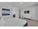 Bright bedroom boasts white dresser, TV, and blue accents, creating a relaxing retreat at 7524 Marker Ave, Kissimmee, FL 34747