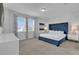 Inviting bedroom with plush headboard, abundant natural light, and neutral decor, providing a tranquil space at 7524 Marker Ave, Kissimmee, FL 34747