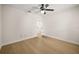 Bedroom features wood floors, a ceiling fan and access to the rest of the home at 7528 Chapelhill Dr, Orlando, FL 32819