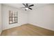 Bedroom featuring wood floors, a window and a closet with a bi-fold door at 7528 Chapelhill Dr, Orlando, FL 32819