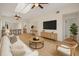 A spacious and open living room filled with light, skylights, and hardwood flooring at 7528 Chapelhill Dr, Orlando, FL 32819