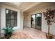 Inviting patio with brick pavers leads to a bright interior with sliding doors and views of a modern kitchen at 7528 Chapelhill Dr, Orlando, FL 32819