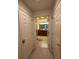 Bathroom view showcasing vanity with mirror, tile floors, and a shower at 7651 Whisper Way # 201, Kissimmee, FL 34747