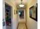Bright hallway featuring tiled floors, recessed lighting, and access to adjacent rooms at 7651 Whisper Way # 201, Kissimmee, FL 34747