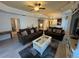 Bright living room with tile floors, an open layout, and stylish furnishings at 7651 Whisper Way # 201, Kissimmee, FL 34747