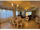 Inviting living space featuring a dining area and open-concept seating with plush sofas and a modern chandelier at 7651 Whisper Way # 201, Kissimmee, FL 34747