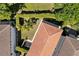 The aerial view reveals the property's mature landscaping and terracotta-tiled roof at 8113 Via Vittoria Way, Orlando, FL 32819