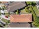 An aerial view of the property with a terracotta tile roof and manicured landscaping in a desirable neighborhood at 8113 Via Vittoria Way, Orlando, FL 32819