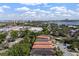 Expansive aerial view showcasing a vibrant neighborhood, lake, and the iconic Wheel at ICON Park at 8113 Via Vittoria Way, Orlando, FL 32819