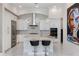 Beautiful open kitchen with modern appliances, a center island, and white cabinets beneath elegant pendant lighting at 8113 Via Vittoria Way, Orlando, FL 32819